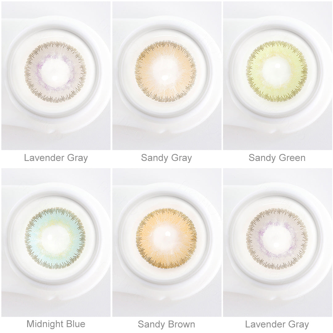 Array of ELITE contact lenses in a white case, showcasing five colors:Lavender Gray,Midnight Blue,Sandy Green,Sandy Gray,Sandy Brown. Each lens is labeled with its color name beneath the case.