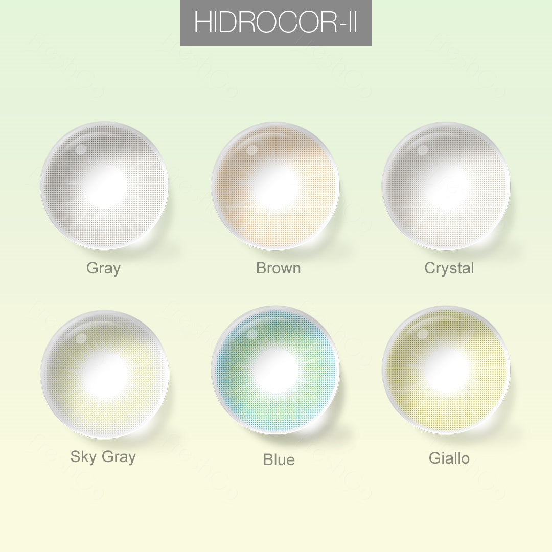 Grid layout of HIDROCOR_II colored contact lenses in various shades with each lens' color name:A brown-eyes model showcasing HIDROCOR_II natural colored contact lenses, display the eyes effect of Gray,Crystal,Brown,Sky Gray,Blue,Giallo with close-up insets highlighting the natural and enhanced eye colors available., on a soft gradient background.