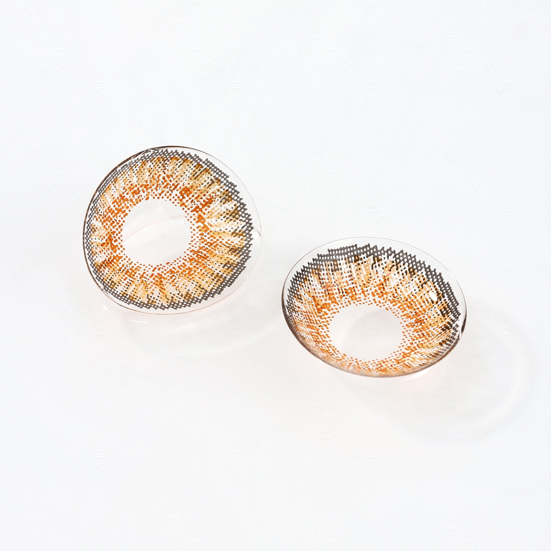 Two lenses of Star contact lenses on a white surface, showing the details of the lens pattern from the front and back