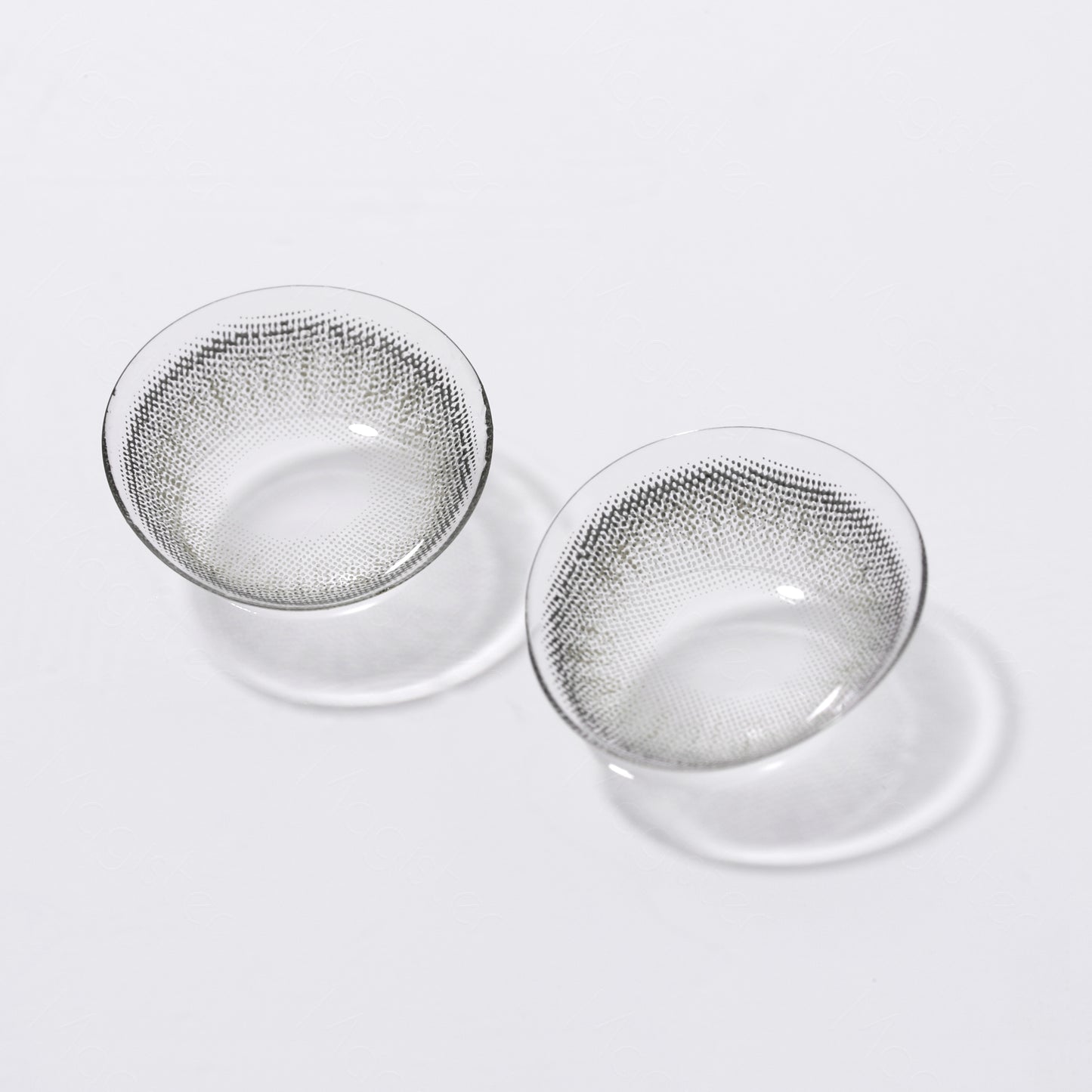 A display of Bunny colored contacts in /Cadet Gray,  shown  as a lens in a close-up of a real  picture.