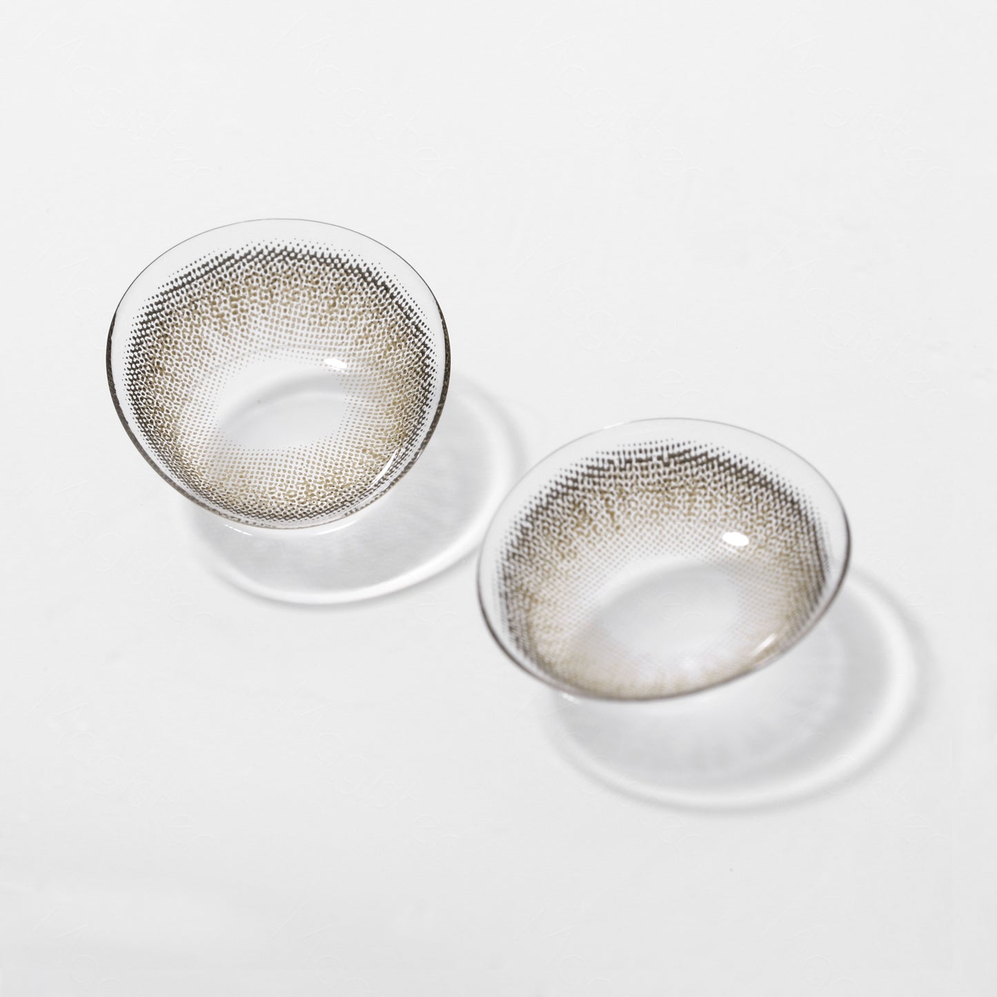 A display of Bunny colored contacts in Walnut Brown,  shown  as a lens in a close-up of a real  picture.