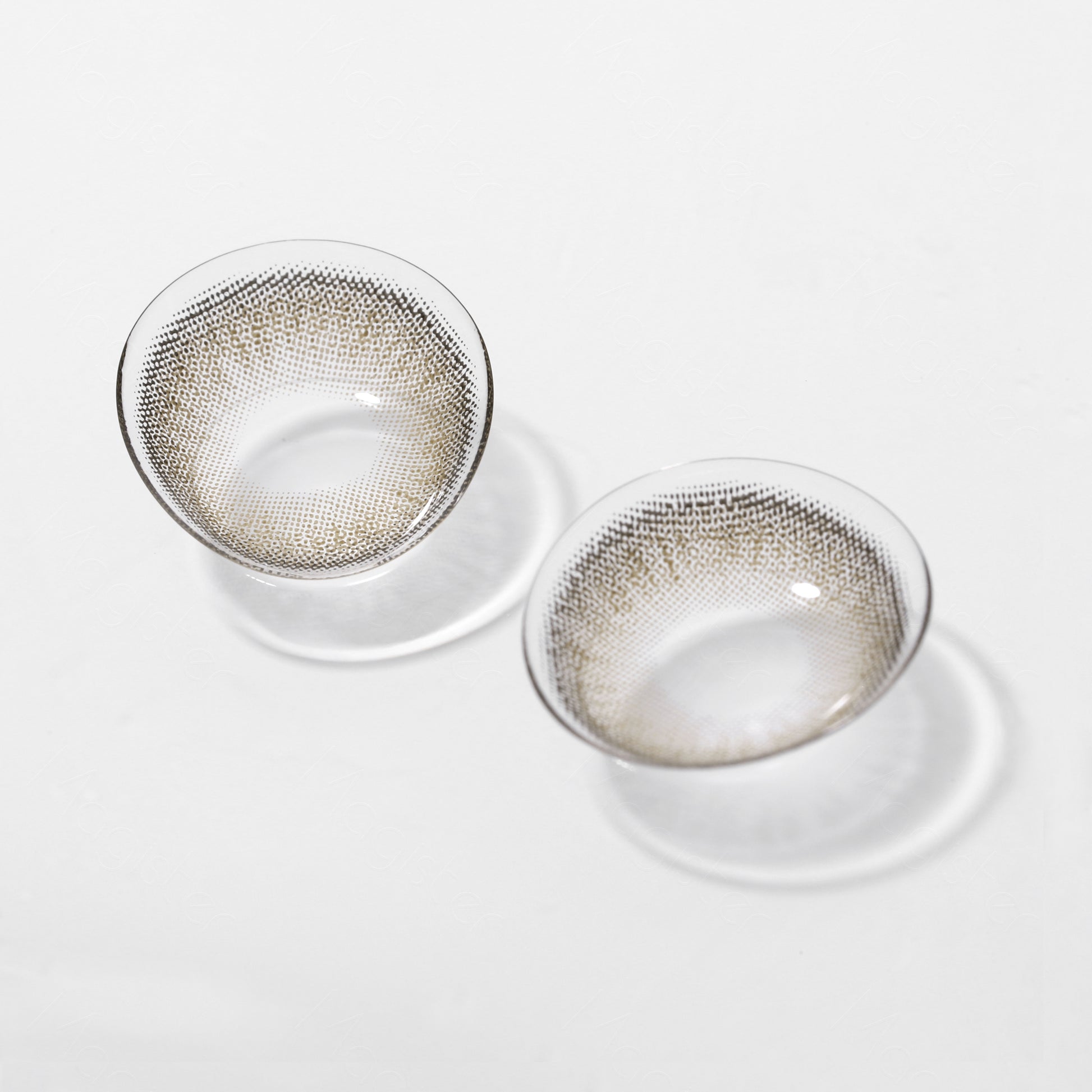 A display of Bunny colored contacts in Walnut Brown,  shown  as a lens in a close-up of a real  picture.