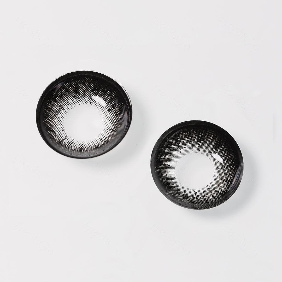 A display of Glass Ball colored contacts in black, shown as a lens in a close-up of a real picture.