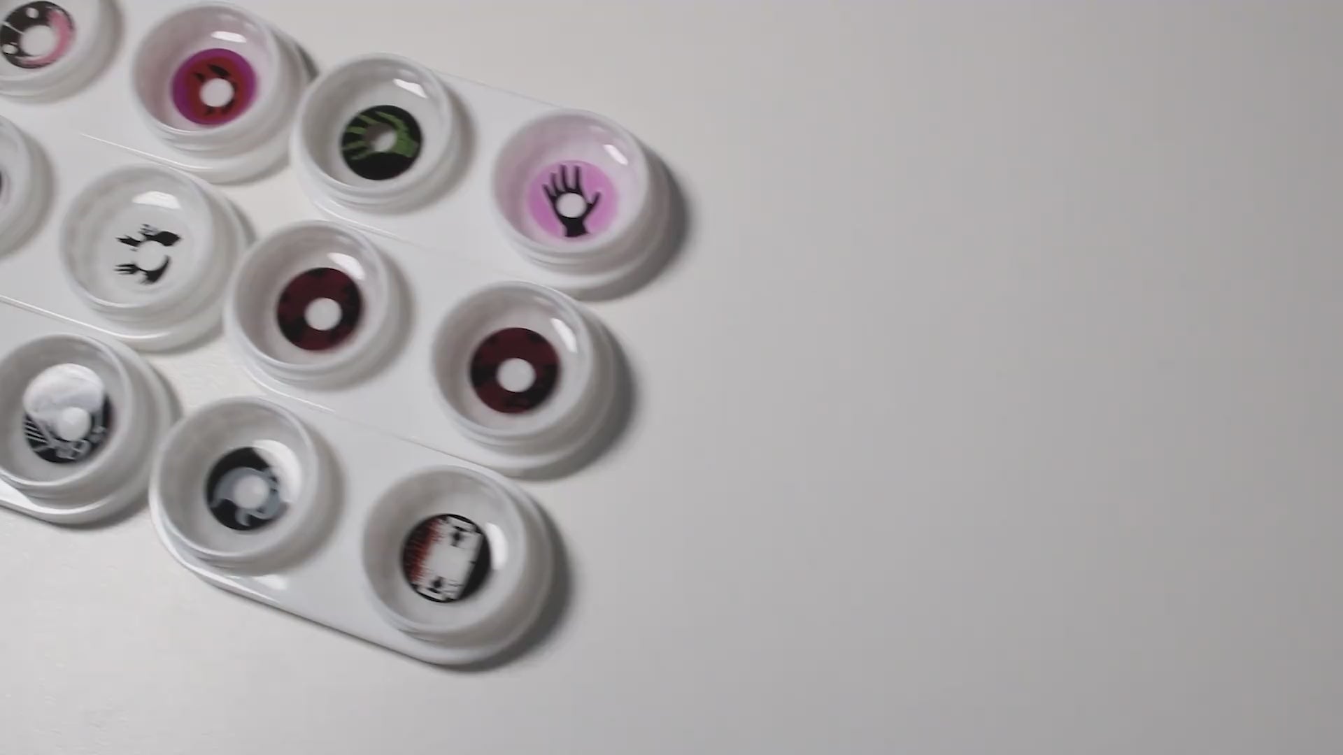 Product video presenting a range of Scary Costume Contacts, featuring close-up views of the lenses in various shades and demonstrating how they appear when applied to the eyes.