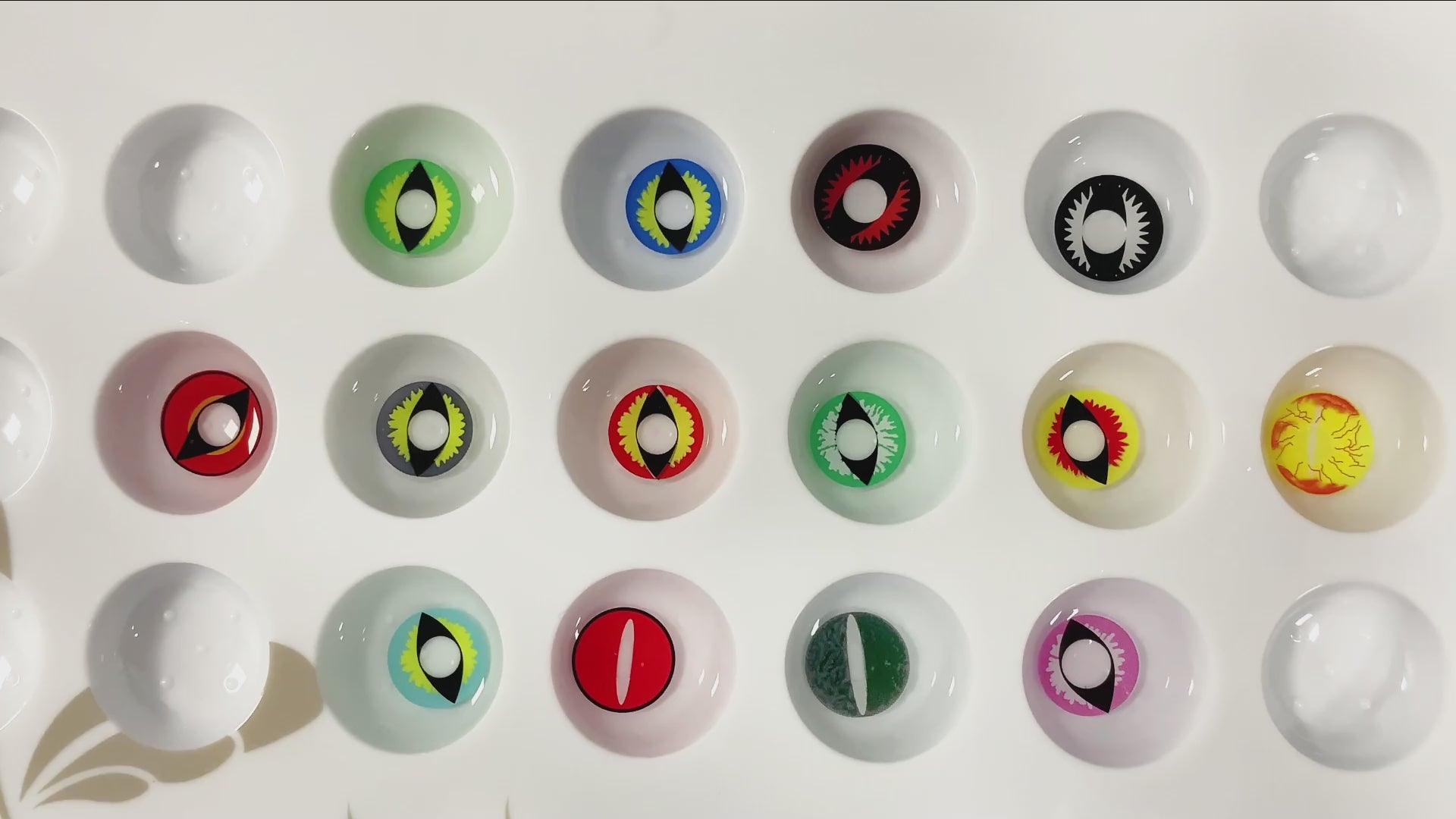 Product video presenting a range of Dragon Eye Costume Contacts, featuring close-up views of the lenses in various shades and demonstrating how they appear when applied to the eyes.