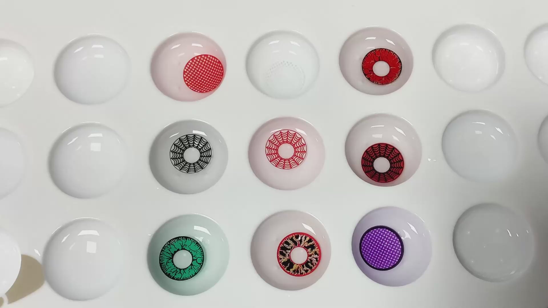 Product video presenting a range of cosplay contact lenses, featuring close-up views of the lenses in various shades and demonstrating how they appear when applied to the eyes.