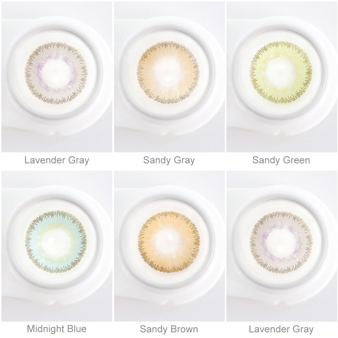 Array of ELITE contact lenses in a white case, showcasing five colors:Lavender Gray，Midnight Blue，Sandy Green，Sandy Gray，Sandy Brown. Each lens is labeled with its color name beneath the case.