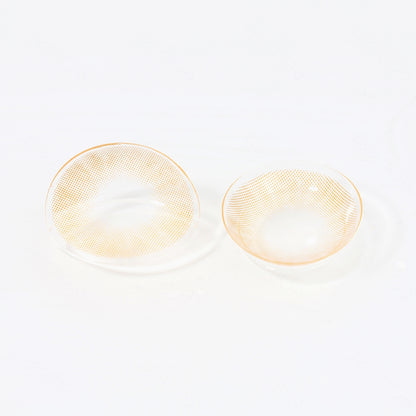 2 pcs lenses of HIDROCOR_II contact lenses on a white surface, showing the details of the lens pattern from the front and back