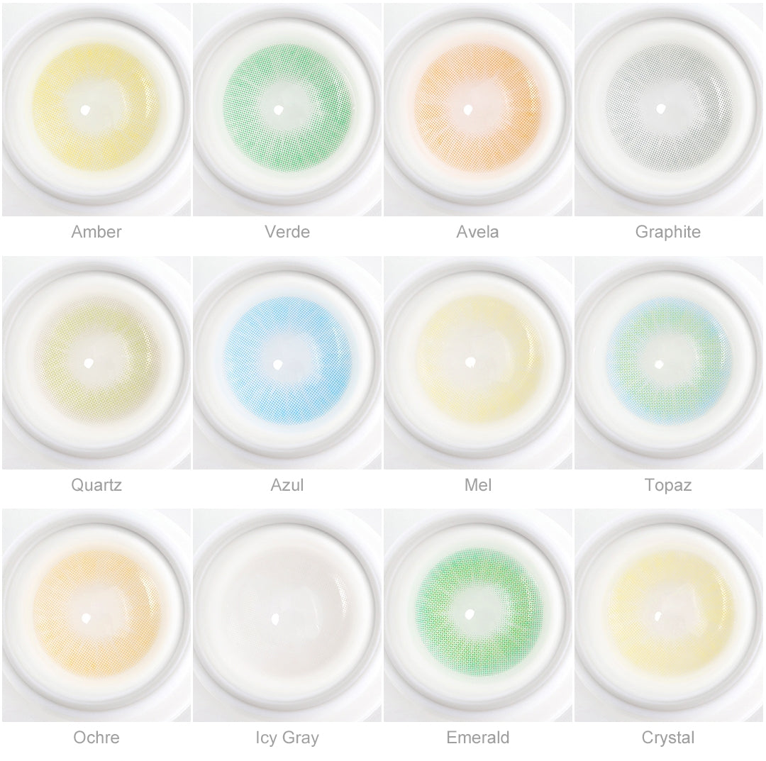 Array of Queen contact lenses in a white case, showcasing twelve colors:Amber，Graphite，Icy Gray，Avela，Ochre，Azul，Mel，Verde，Quartz，Crystal，Emerald，Topaz. Each lens is labeled with its color name beneath the case.