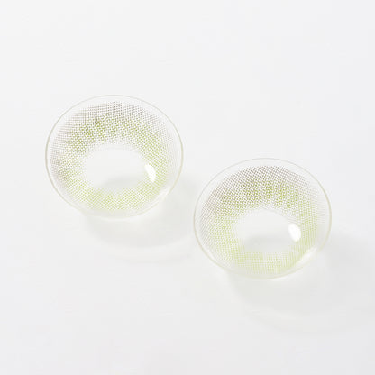 2 pcs lenses of Queen contact lenses on a white surface, showing the details of the lens pattern from the front and back