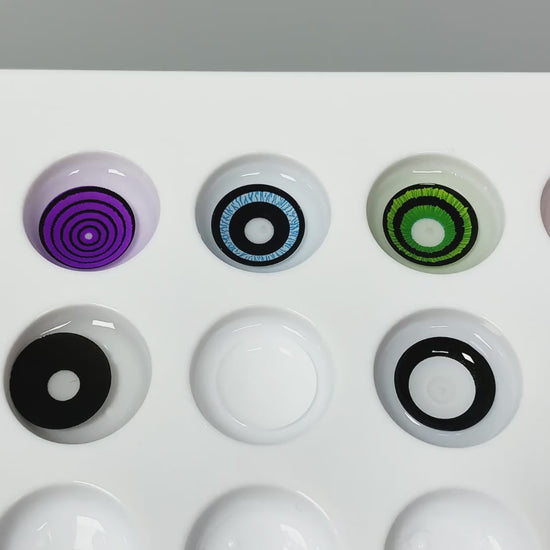 Product video presenting a range of Anime Sharingan Costume Contacts, featuring close-up views of the lenses in various shades and demonstrating how they appear when applied to the eyes.