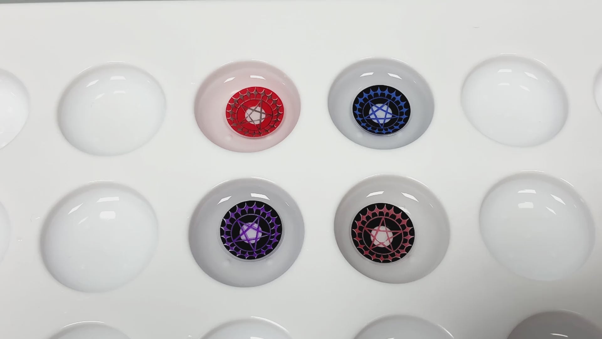 Product video presenting a range of five-pointed star shape cosplay contact lenses, featuring close-up views of the lenses in various shades and demonstrating how they appear when applied to the eyes.